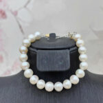 L046 - Lắc tay trứng 7-8 li ánh tím/trắng